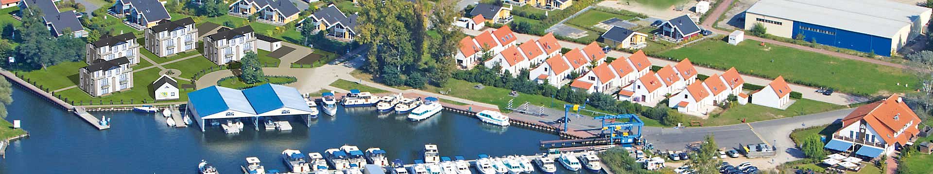 Luftbild mit der Visualisierung der Marina Müritz Apartments - Wohnung kaufen Müritz